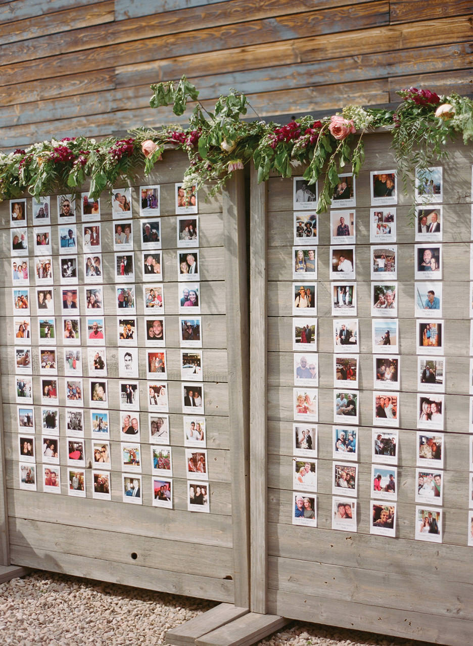 A unique escort card board is set up outside with polaroid of each guest using their Facebook profile photo. 