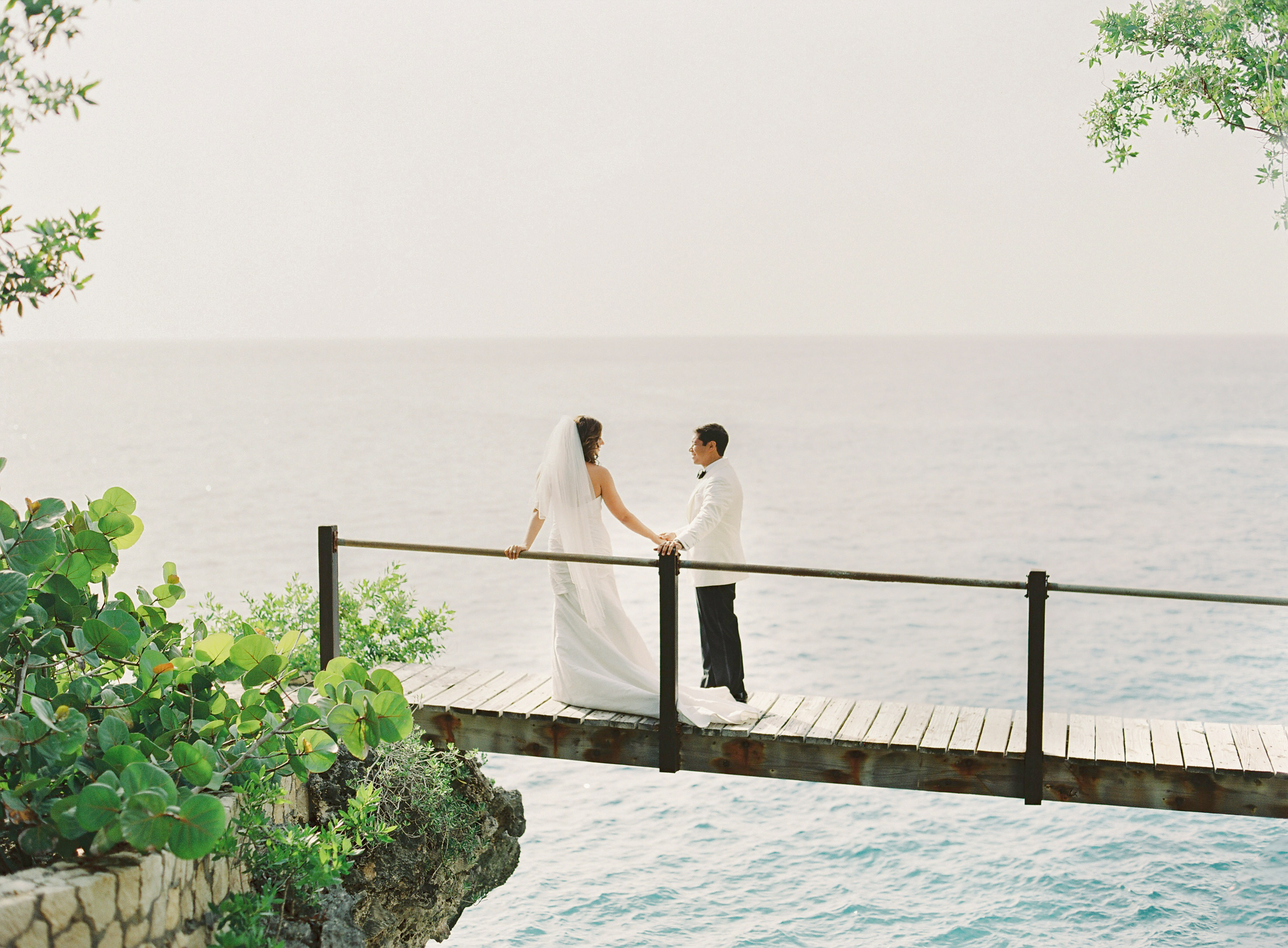 Couple do a First Look on a bridge at the Rockhouse Hotel in Negril, Jamaica.