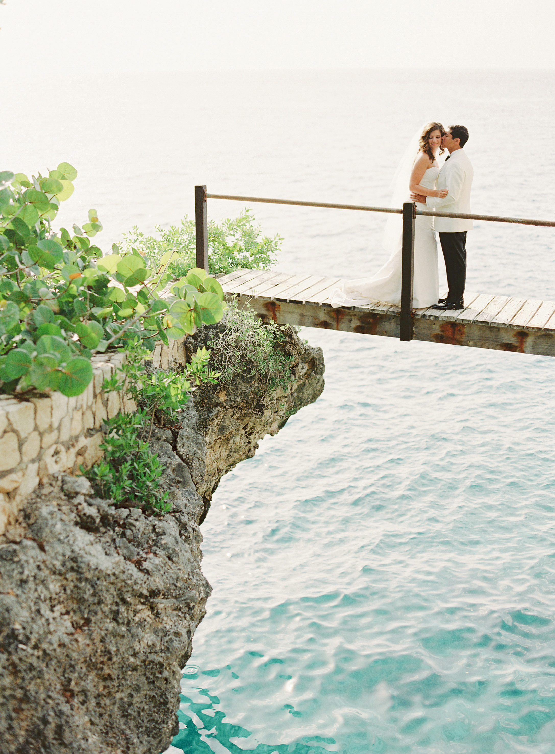 Couple do a First Look on a bridge at the Rockhouse Hotel in Negril, Jamaica - First look Pros and Cons