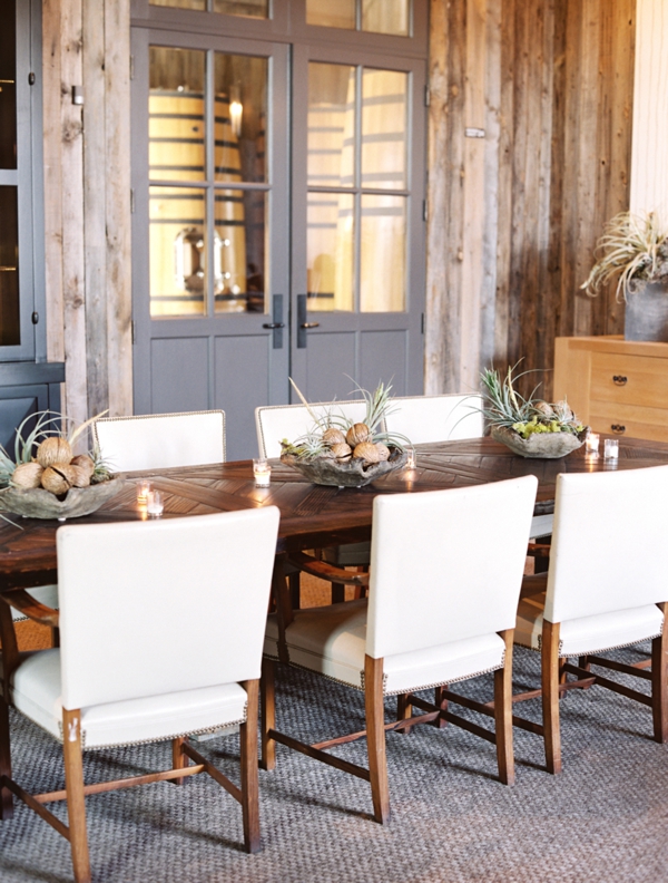 A long farmhouse table setting white chairs Ram's Gate Winery in Sonoma. 