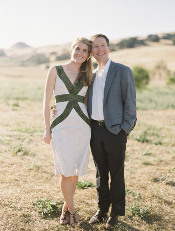 A couple pose together in the rolling hills of Ram's Gate in Sonoma during their anniversary party. 