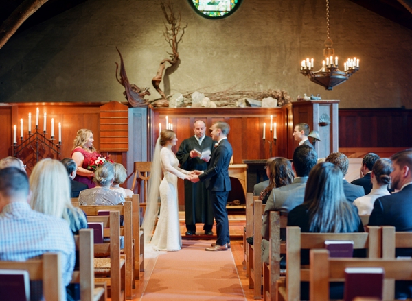 A bride and groom share vows during their intimate city wedding at Swedenborgian Church in San Francisco.