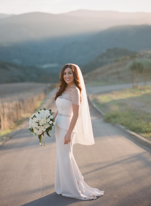 Portrait of a bride in a dirt road of Carmel Valley.