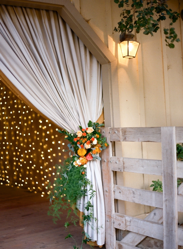 Autumn Holman Ranch Wedding details with orange, peach, and cream florals adorning the reception barn. 