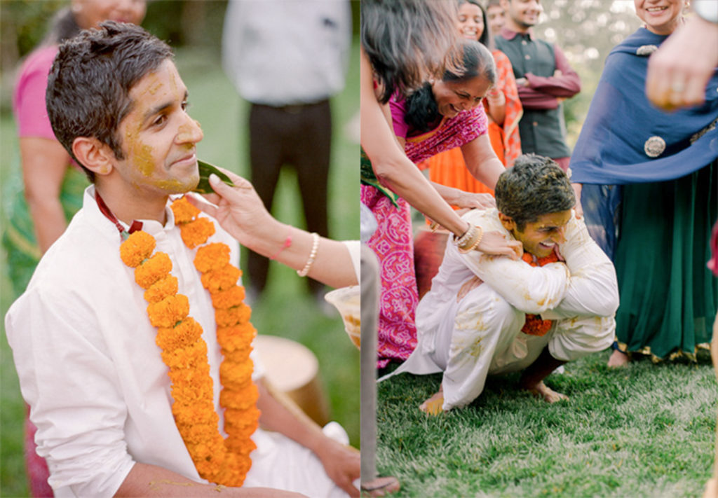 During a Haldi ceremony in Napa Valley the groom has turmeric paste applied with a green leaf.