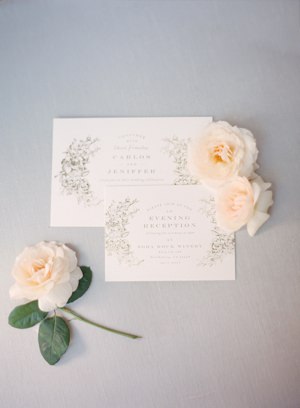 White and gold wedding invitations with flowers