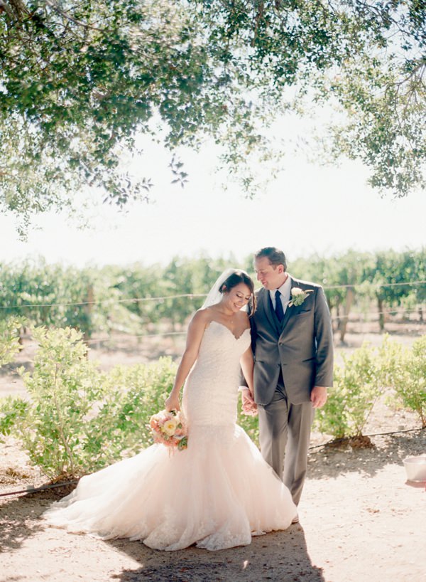 Bride and Groom hold hands at Soda Rock Winery Wedding in Napa Valley